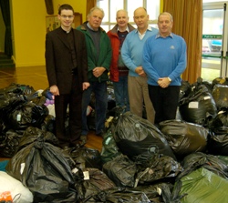 Pictured at Agherton Church Hall, Portstewart are Rev Niall Sloan, along with members of the Church of Ireland Mens Society, George Gibson, Bob Hagan, Derek Sweetnam and Joe Connor, pictured with the huge amount of clothes they gathered, to be sent to Minsk in Russia. Picture courtesy of the Coleraine Chronicle.